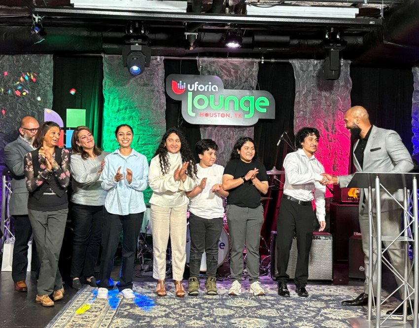 Tu Futuro scholarship recipients and their families celebrate on stage