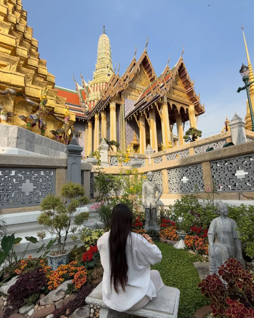 women sitting in front of temple
