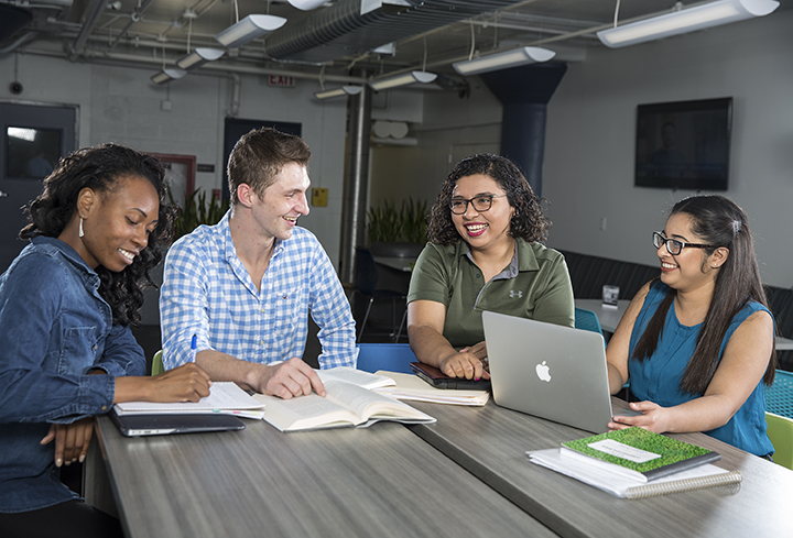 students studying around a table