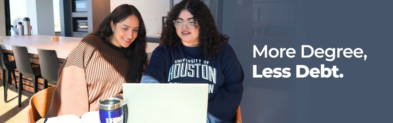 female students working on their laptop