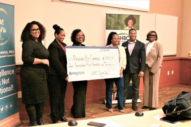 Designs by Chimere awarded check