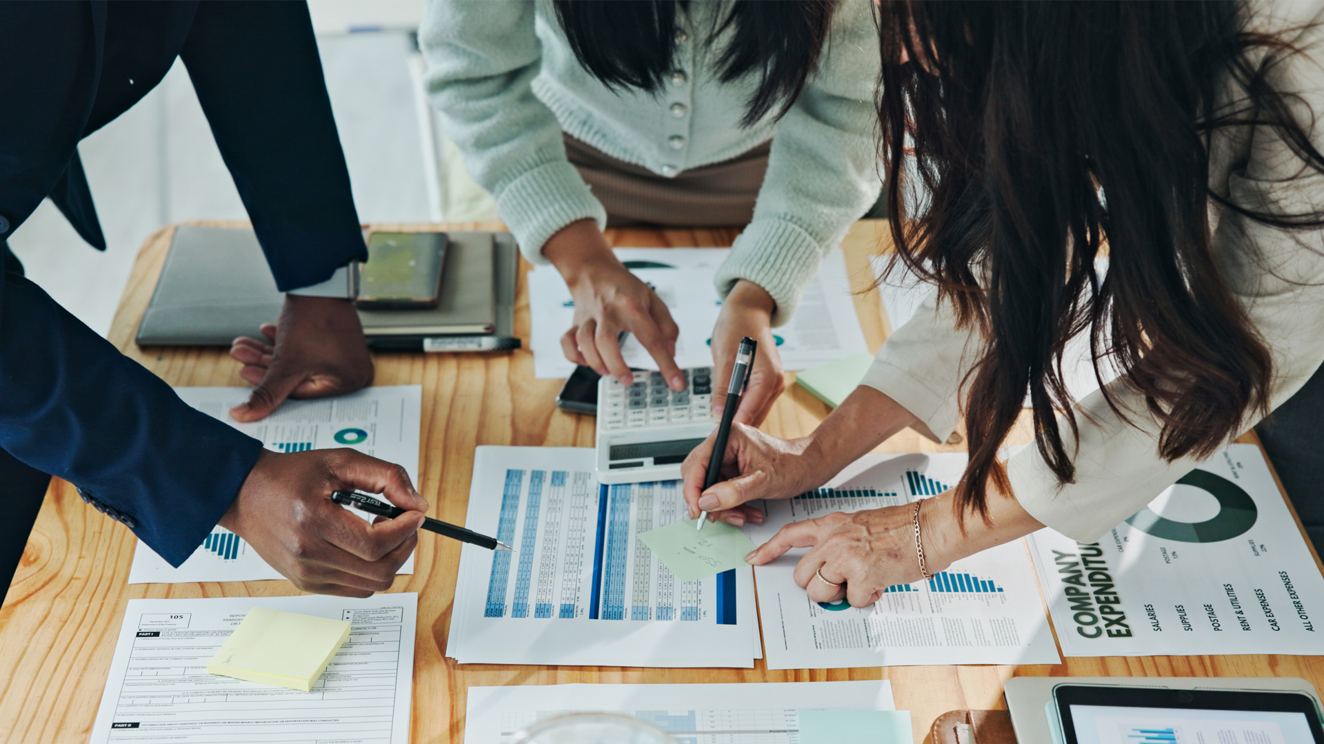 accounting professionals reviewing budget documents