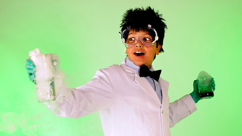 Teen boy dressed like mad scientist