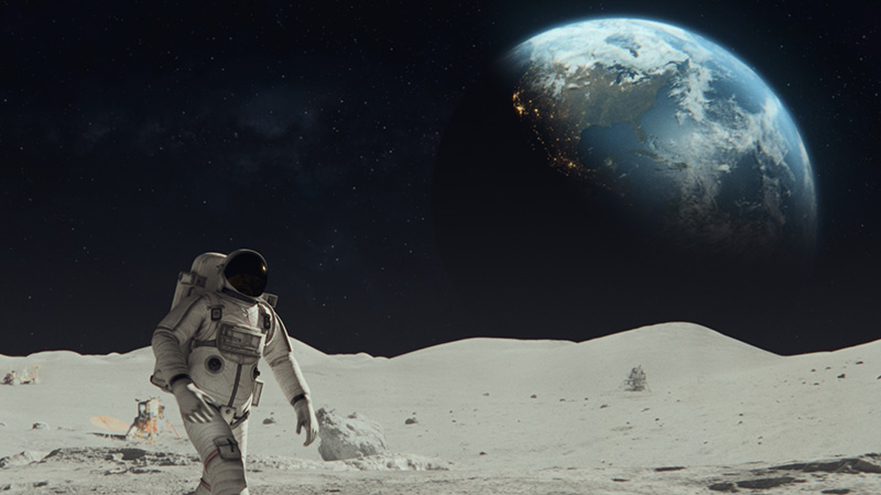 Astronaut in a space suit walking on the moon