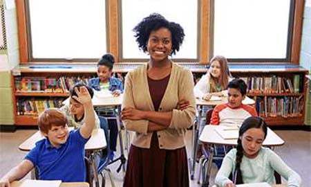 Teacher and students smiling