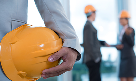 Person holding a hard hat