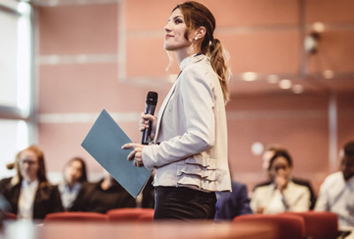 Women holding a mic