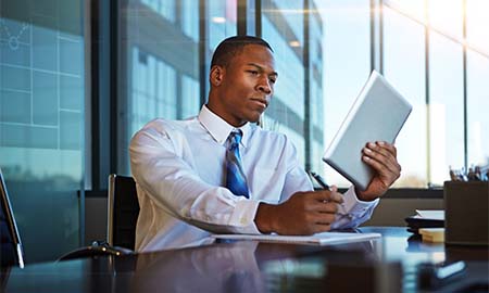 Man looking at tablet