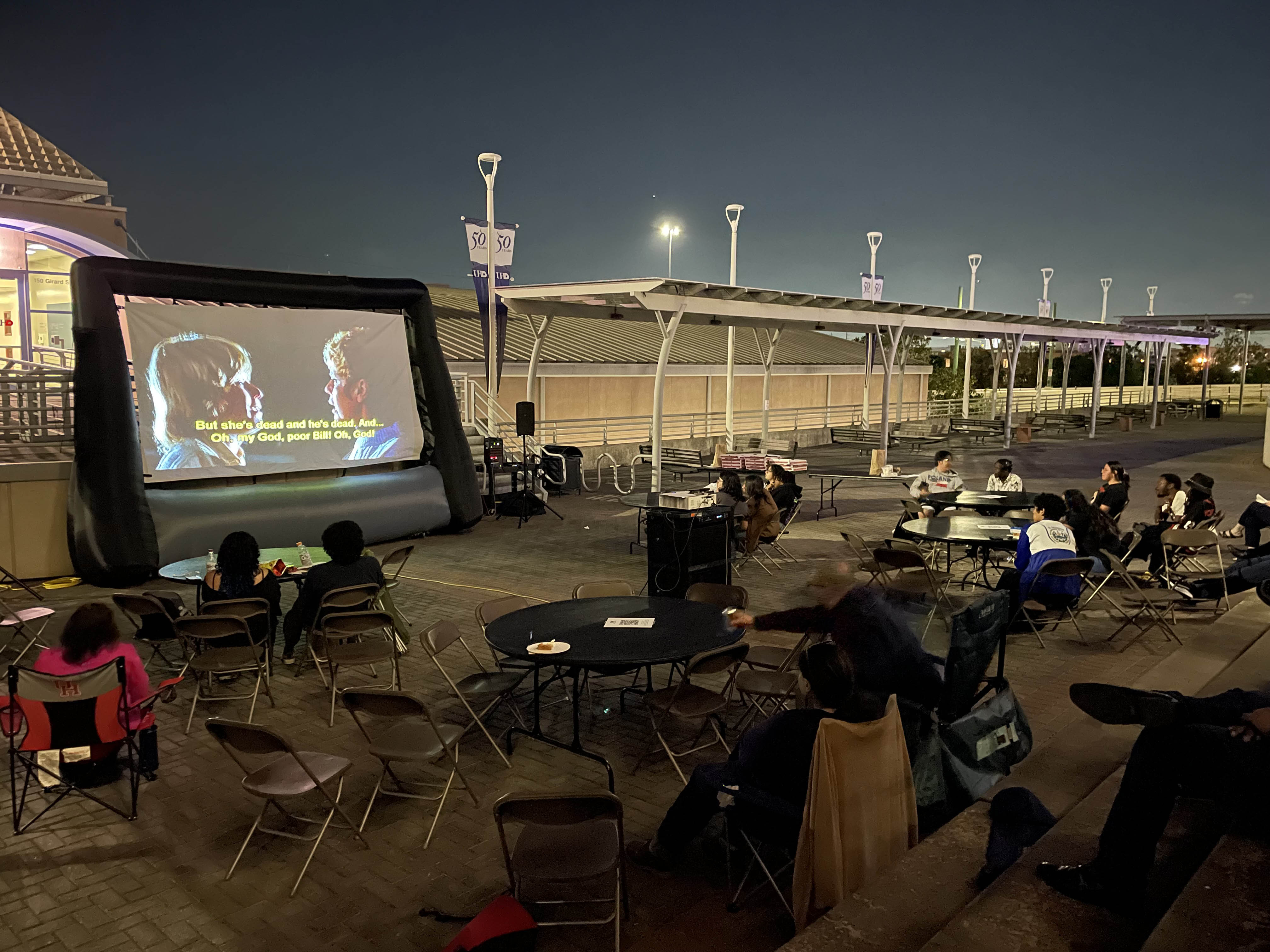 UHD community enjoy outdoor screening of horror film on the main building north deck