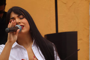 female singing into microphone