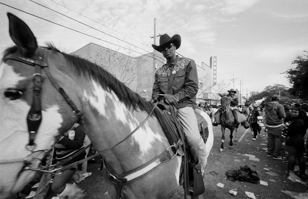 Untitled - black and white photo of man on horse