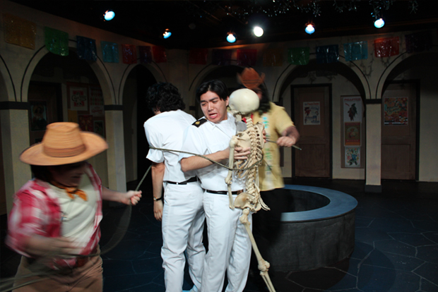 three actors and a skeleton are tied together by two other actors