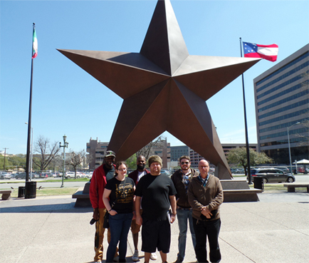 UHD students in front of Star statue as the State History Museum