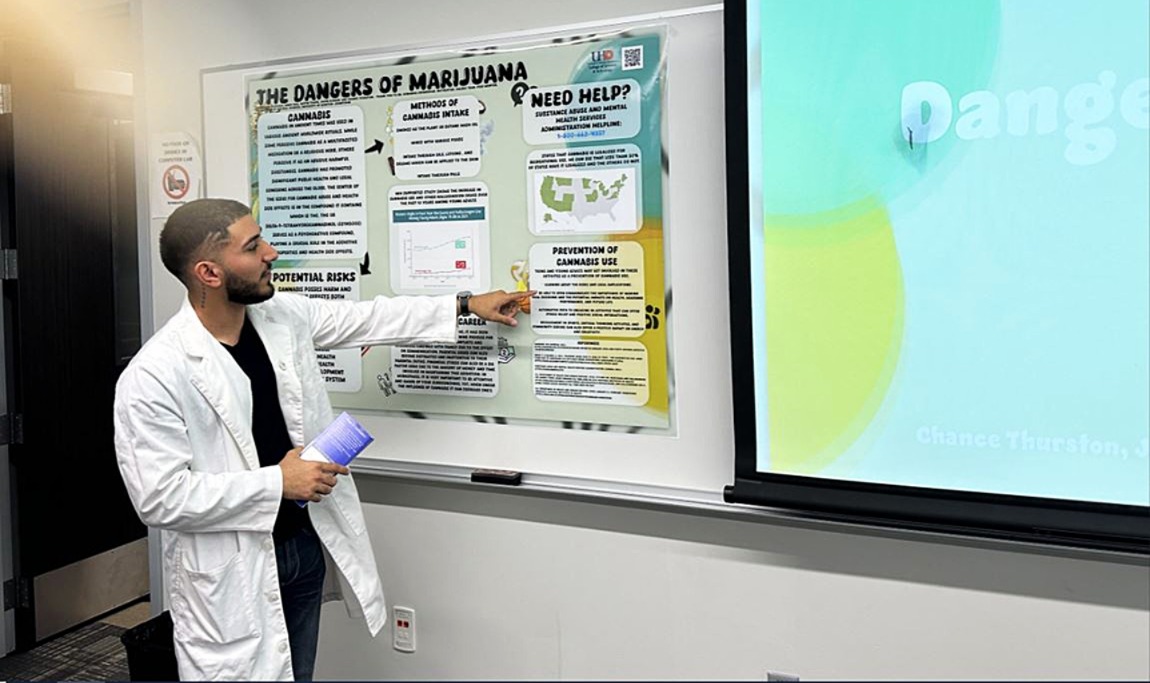 Student presenting poster