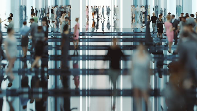 People in a lobby of a office building blurred