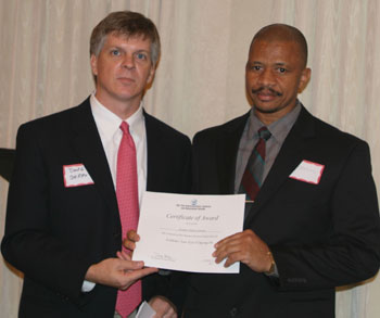 President Mr. Grantley Christie getting the awarded 2007 ISA Student Scholarship