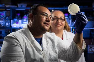 Two scientists looking at an experiment