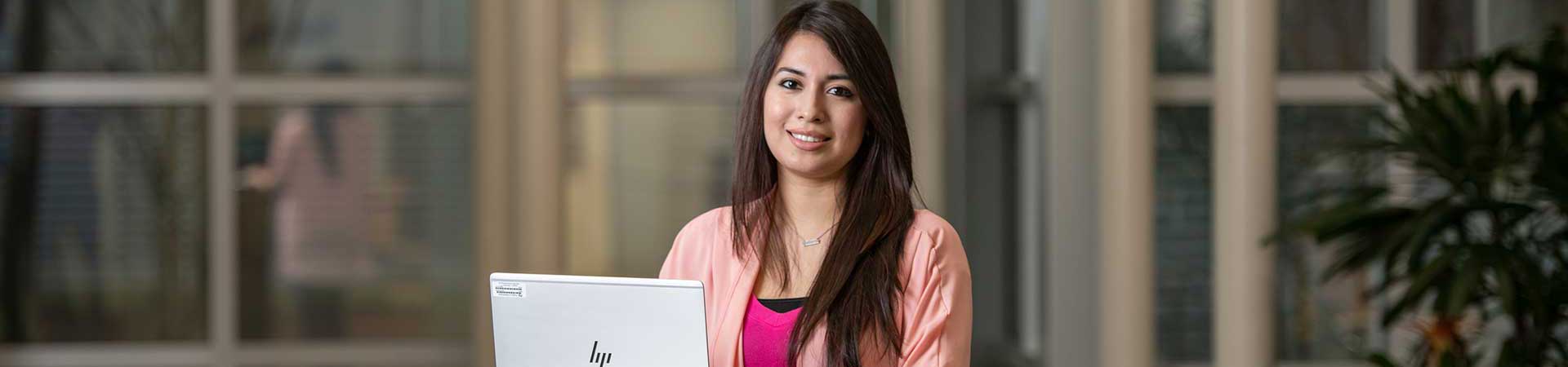 Student workig on her laptop