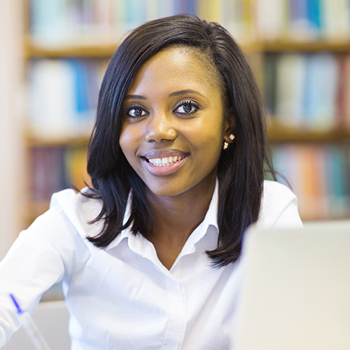 Smiling student using laptop Smiling student using laptop