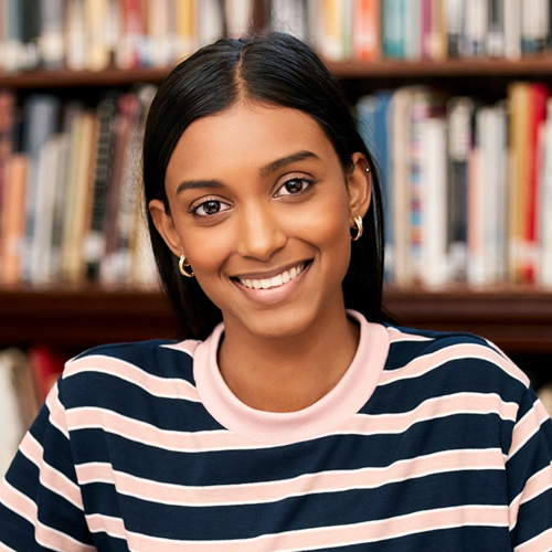 female student smiling at the camera