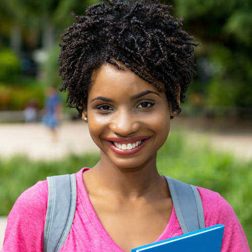 international student smiling at the camera