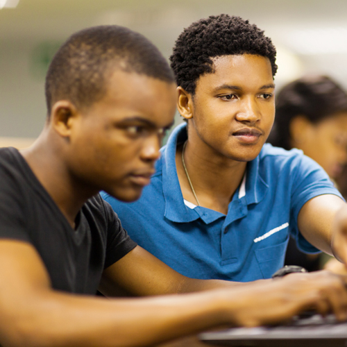 two students working on a laptop two students working on a laptop