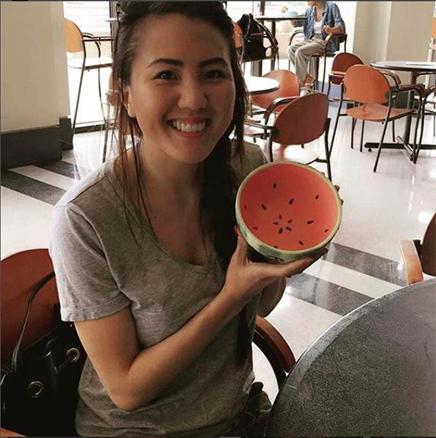 student holding decorated bowl