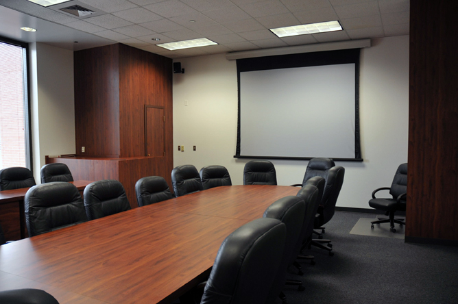 Conference room with a long table and chairs