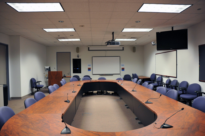 Meeting room with tables and chairs at a round table