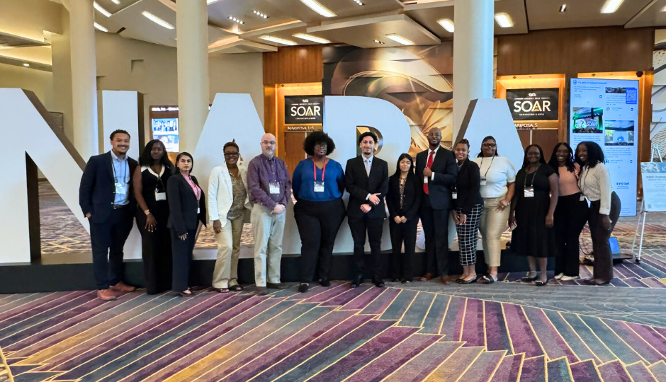 NABA Conference group of people in front of NABA letters