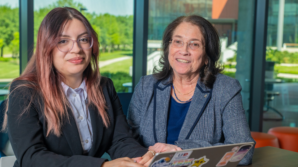 Mary jo parker executive director of uhd's scholars academy sits aside Computer Science major Jessica Gonzalez