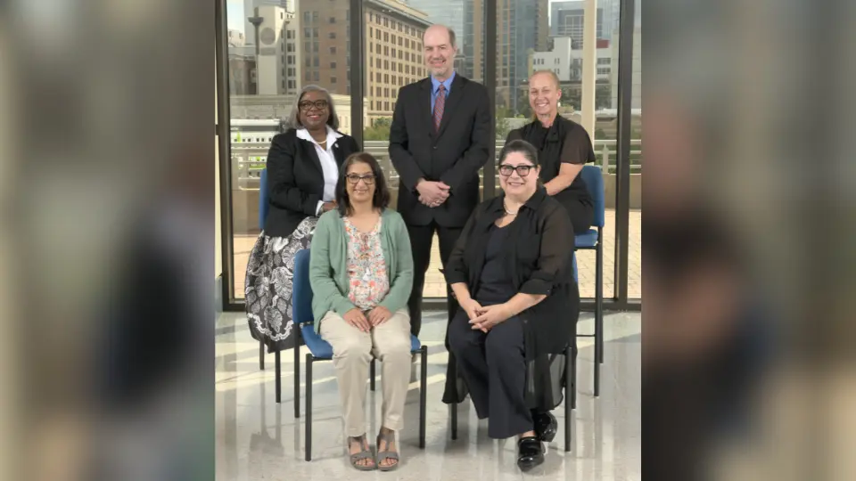 Photo of five faculty award winners gathered at the awards banquet