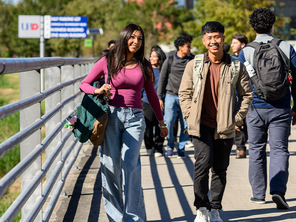 Students walking outside between UHD Buildings