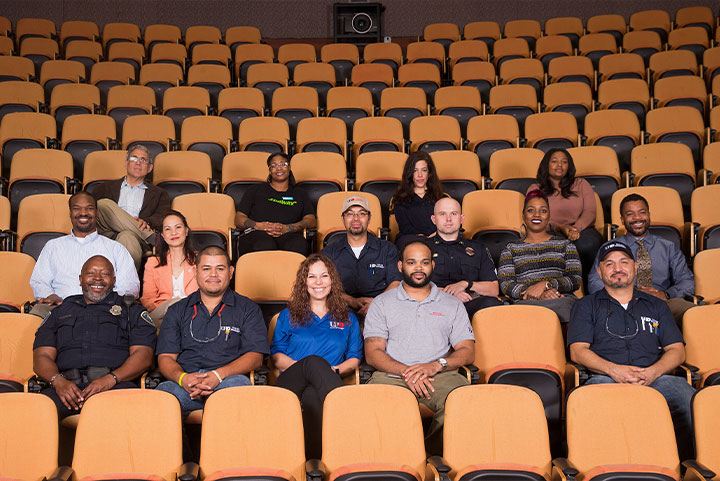 A group of employees in an auditorium.