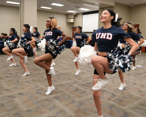 Cheerleaders perform a quality enhancement plan cheer at the QEP Pep Rally at the university of houston-downtown in houston, texas