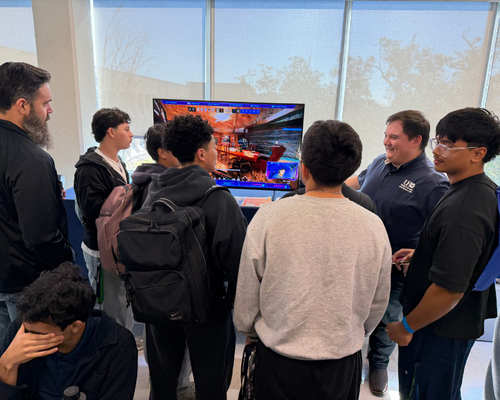 Early College High School south students listen to the university of houston-downtown esports coordinator richard rodriguez discuss the program 