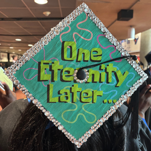 graduation cap with text that reads, "one eternity later"