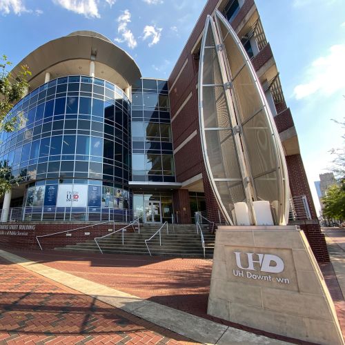 Entrance of the College of Public Service building on Commerce Street.