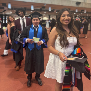 students stand in line while waiting for walk cards at uhd's 78th commencement ceremony