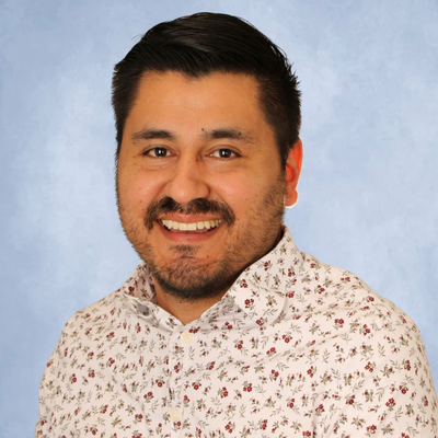 Luis Avila, security officer at the university of houston-downtown smiles