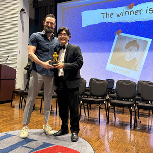 luke fedell stands with a theatre student at student awards ceremony at the university of houston-downtown