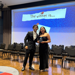 A student receives an award at the university of houston downtown's one main event student awards