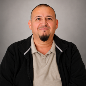 ricardo reyna smiles. Reyna is a police officer at the university of houston-downtown in downtown houston.