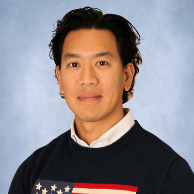 Vinh luong wears a sweater with an american flag