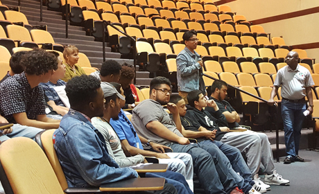 students in the auditorium participate in the panel discussion
