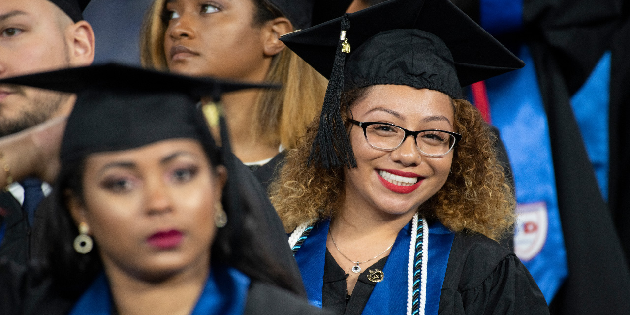 UHD Commencement student smiling