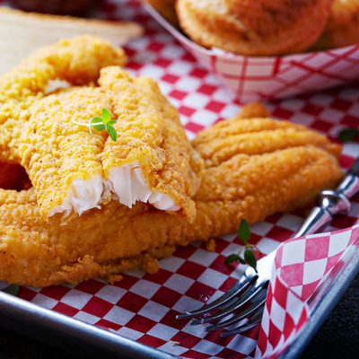 Fried catfish sits in a basket