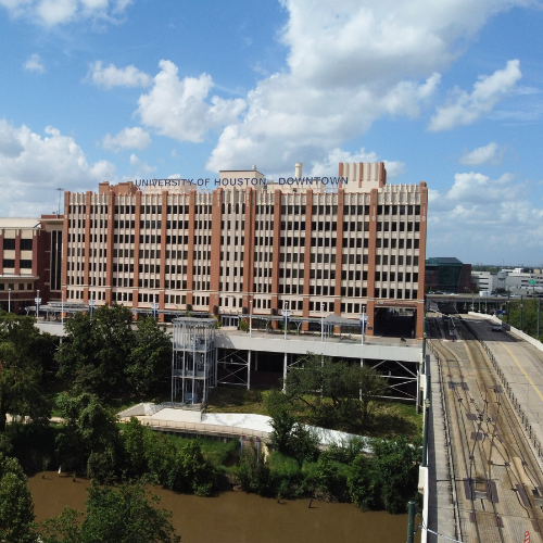 The University of Houston-Downtown's One Main Building, the bayou, and a bridge in downtown Houston