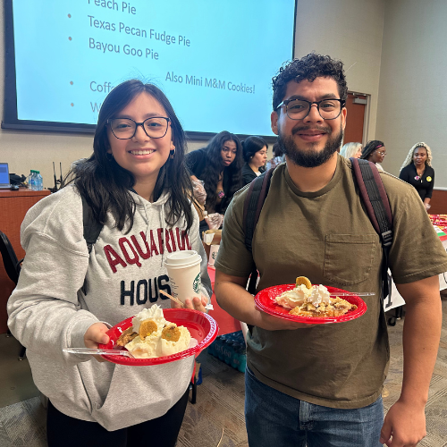 students hold plates of pie at the university of houston-downtown's pi day event hosted by the mathmatics and statistics department in the college of sciences and technology