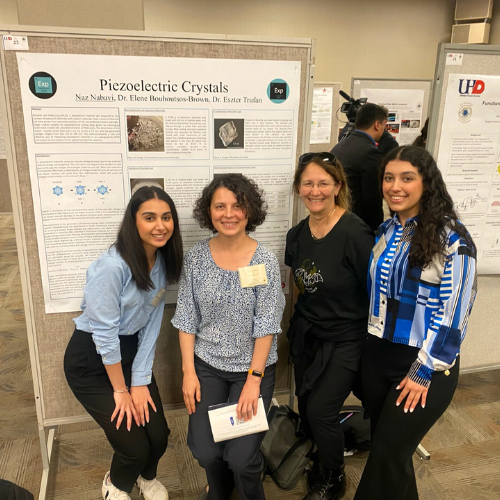 Eszter Trufan, associate professor of Chemistry at UHD, and Elene Bouhoutsos-Brown, Chemistry adjunct faculty at the university, stand aside two students and a posterboard